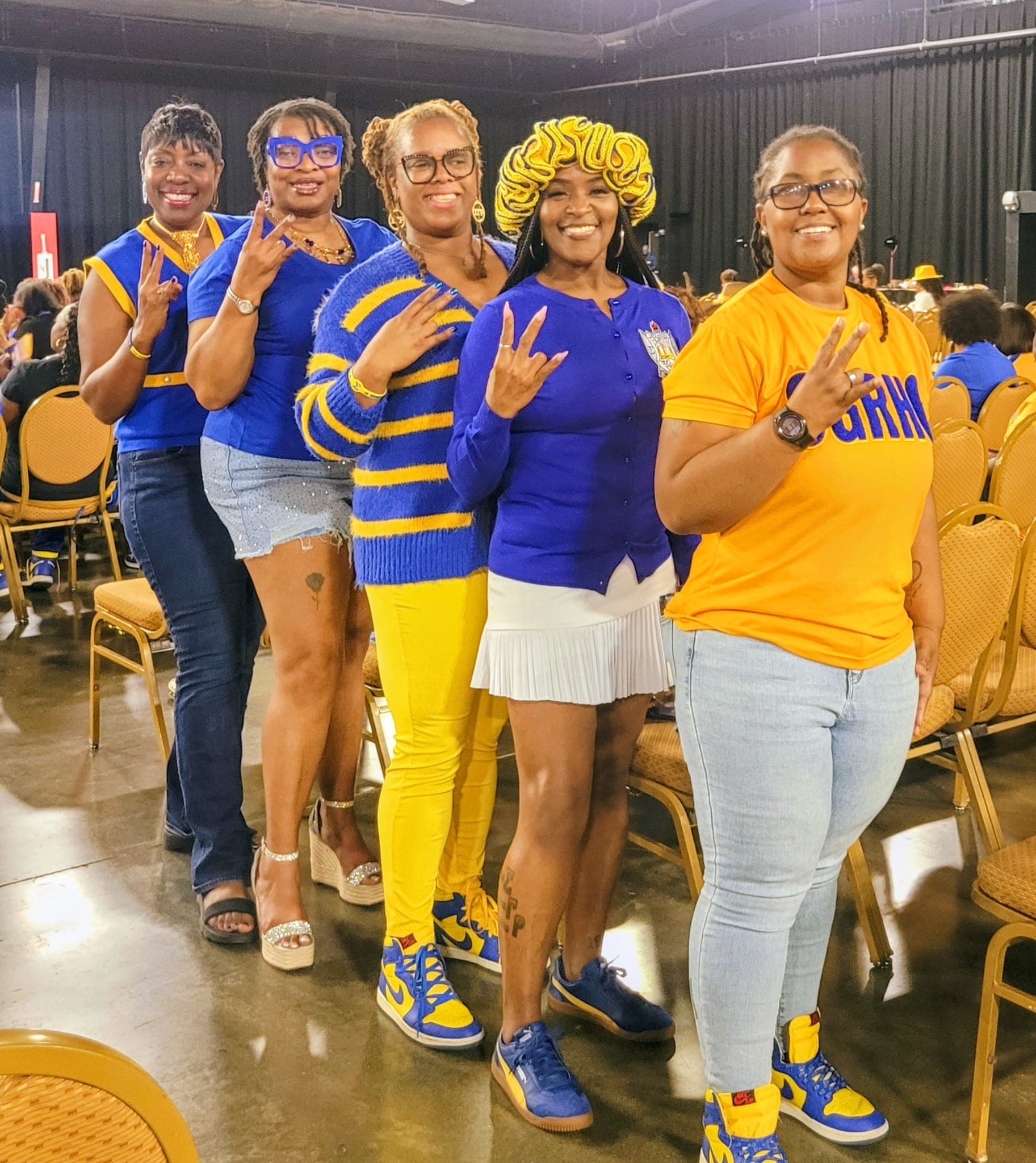 Xi Gamma Sigma sorors in royal blue and gold
